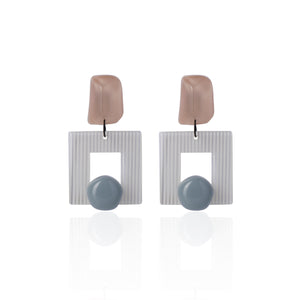 Morandi pink handcrafted earrings on white background