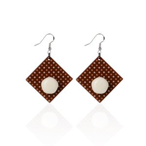 white handcrafted earrings on white background