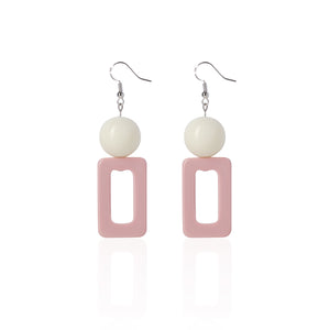 pink handcrafted earrings on white background