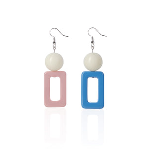 blue and pink handcrafted earrings on white background